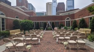 Empty chairs at outdoor wedding in Philly courtyard